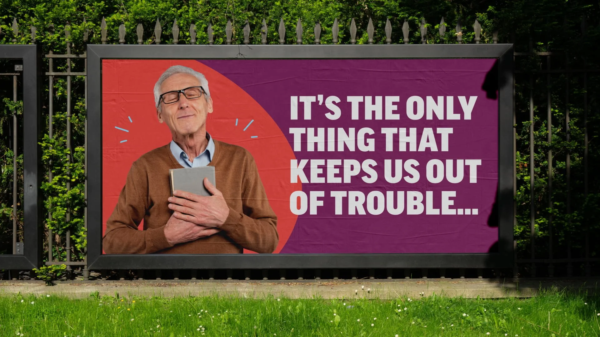 Man with his eyes closed clutching a book to his chest looking happy with bold text that says 'Its the only thing that keeps us out of trouble'