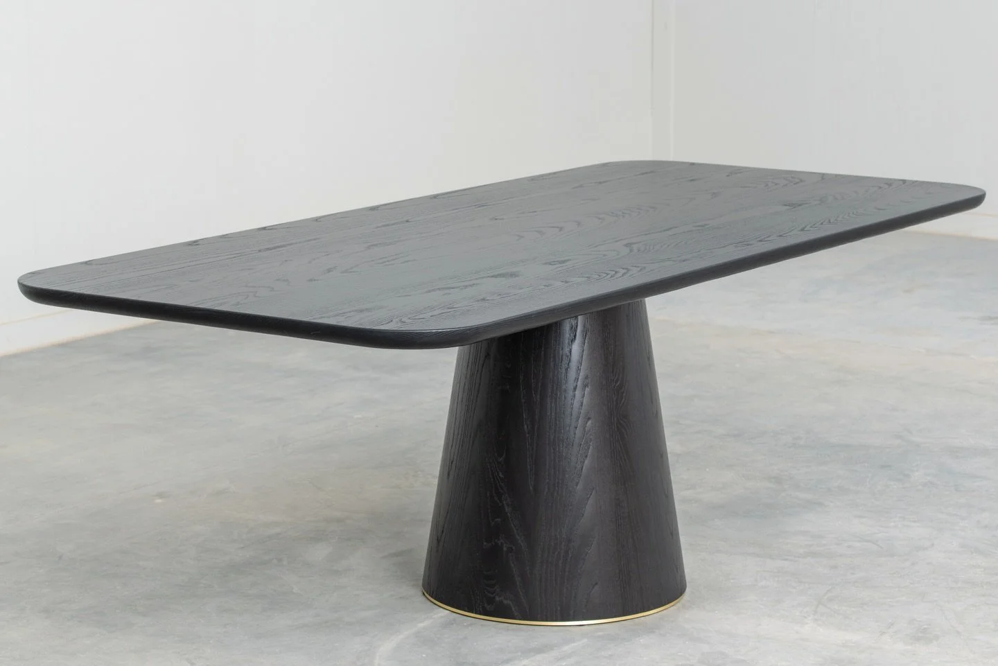 A study in restraint &mdash; sleek, tailored, and finished with a delicate brass shoe just peeking out. ✨

Custom Tapered Pedestal Table for the talented @nicolehirschinteriors, handcrafted in solid ash and shown in Cafe Noir &mdash; a deeply intense