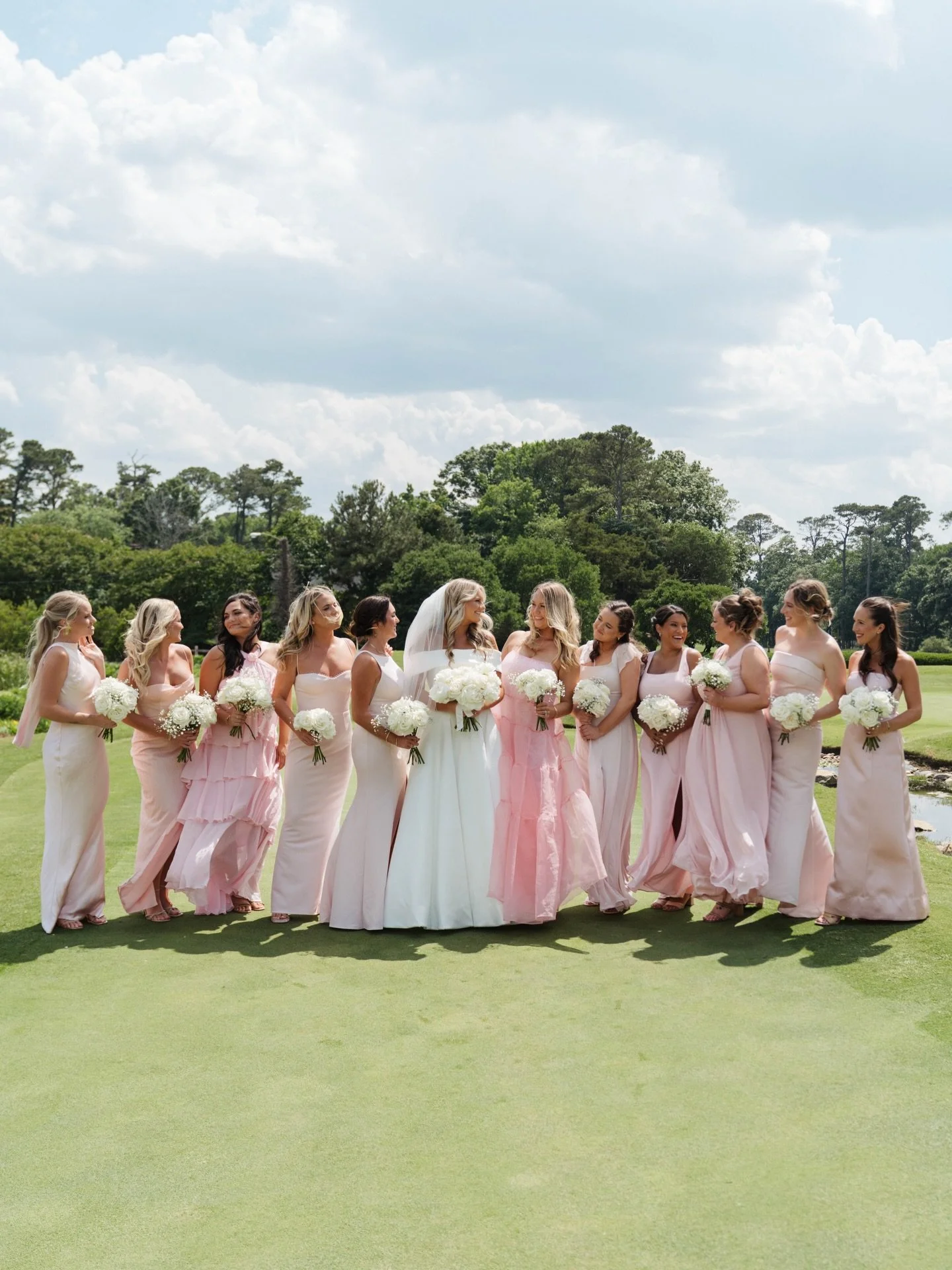 A moment for the bride and her girls in pink! 💓

As wedding planners, we always love when a bride gives her bridesmaids the freedom to choose a style that truly feels like them! Same color, different dresses &mdash; and suddenly everyone&rsquo;s mor