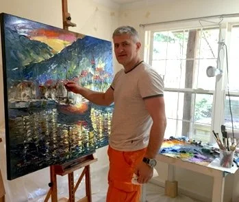 Vova Piven in his Ukraine studio working on a large painting on the easel