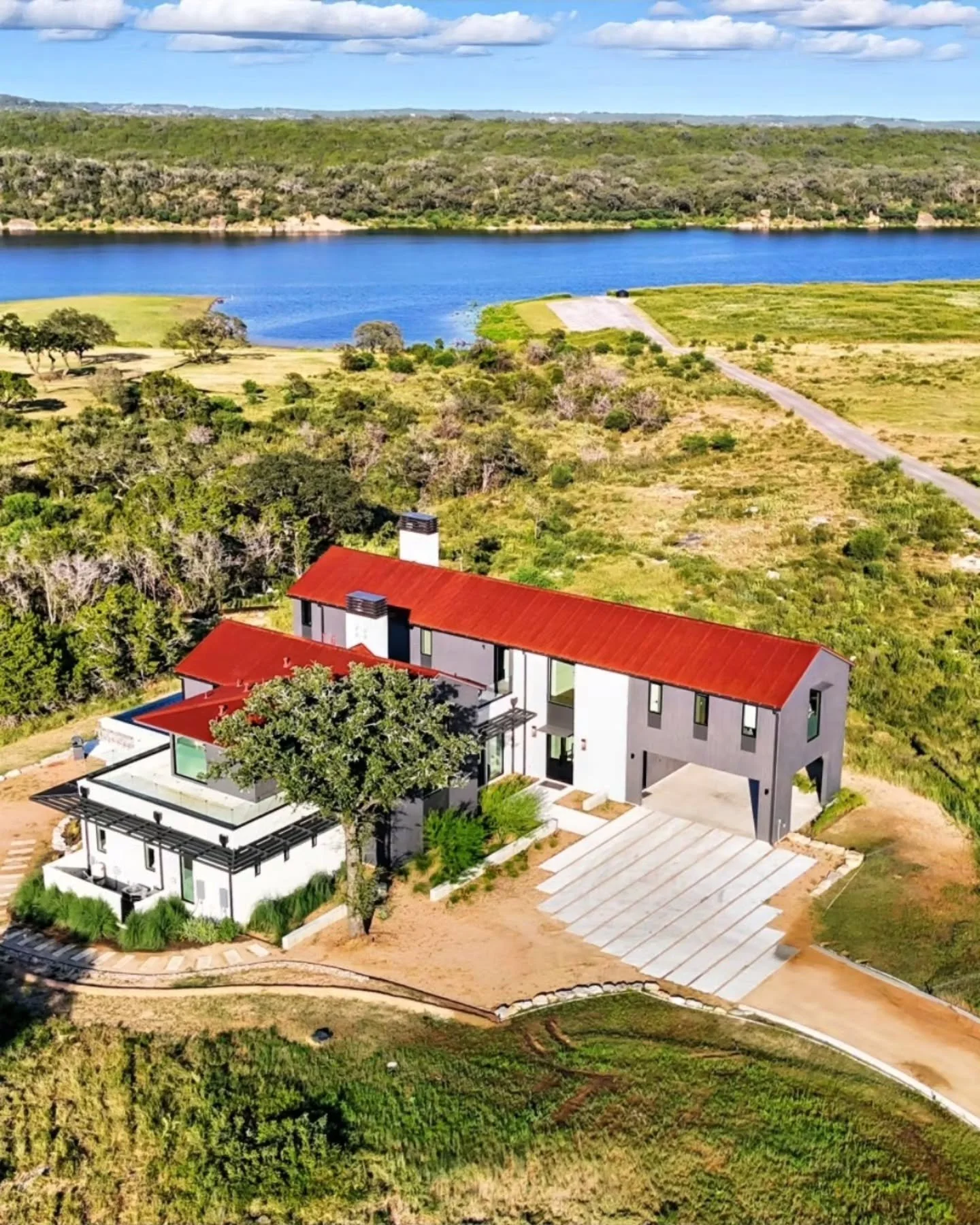 From above, the Traditional Model Home&rsquo;s architecture reveals its relationship with the land. Thoughtfully scaled volumes, warm materials, and a layout that opens toward sweeping Hill Country views and the water beyond. 

Every element is place