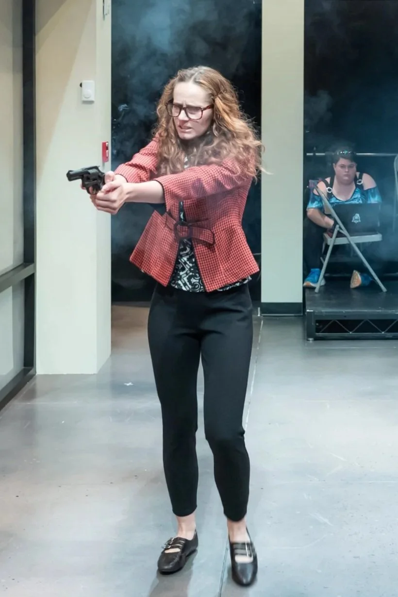 Coordinated costume-related safety around SFX, including sprays of blood, bladder rig, and smoke and sparks from a realistic prop gun.