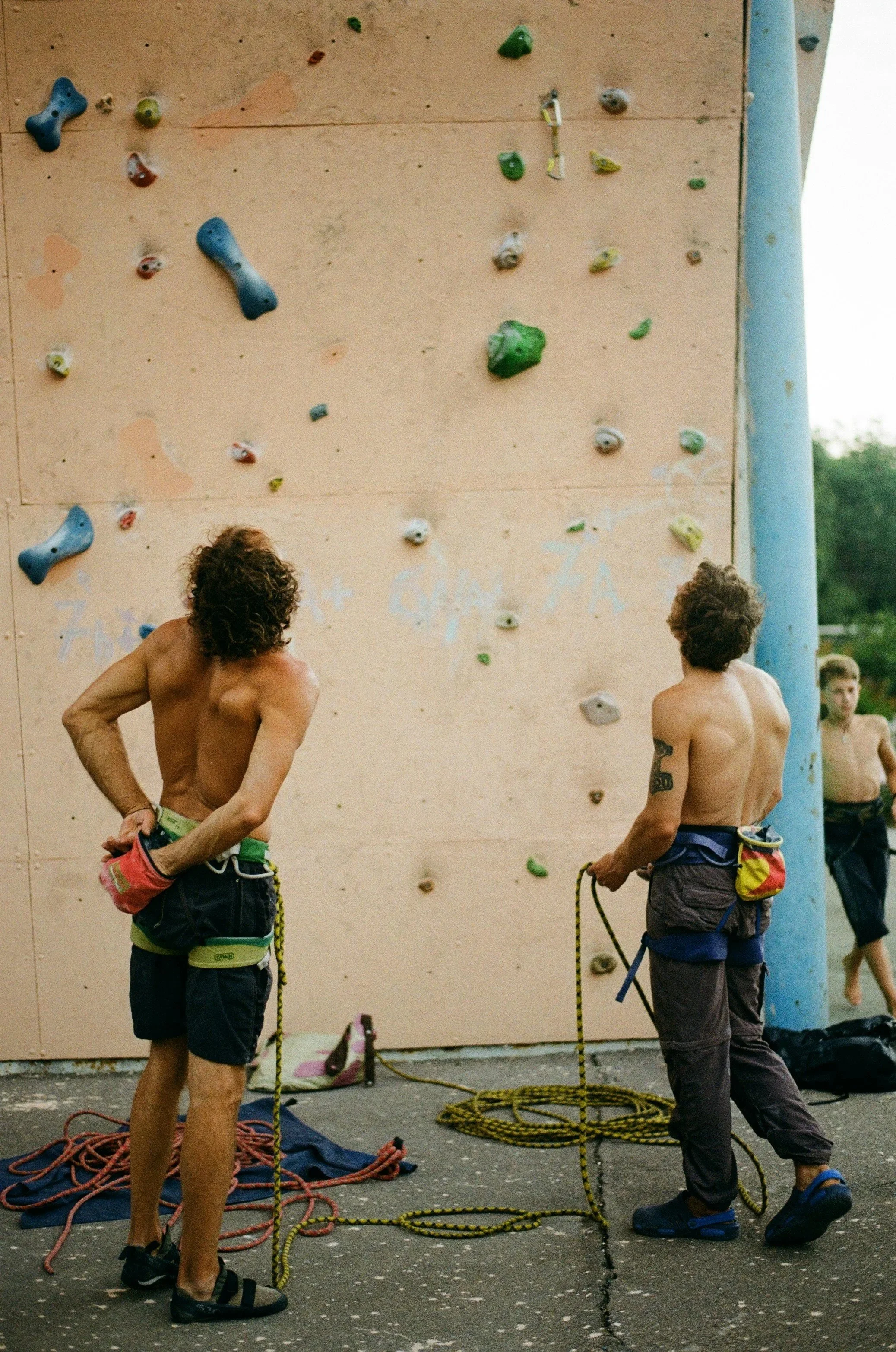 Climbers scouting beta on a sport route.