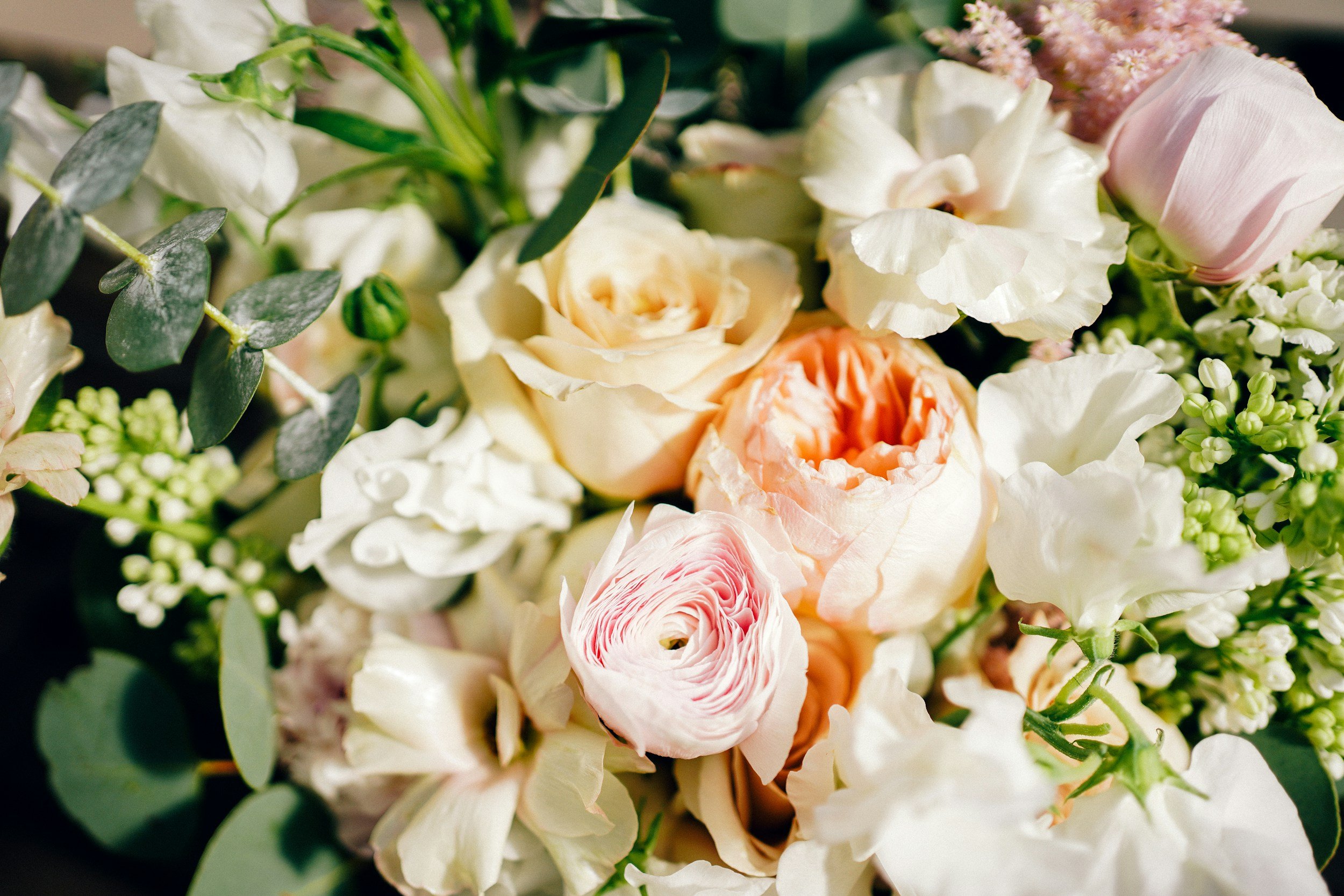 Beautiful romantic wedding bouquet with soft neutral flowers arranged to showcase the flowers