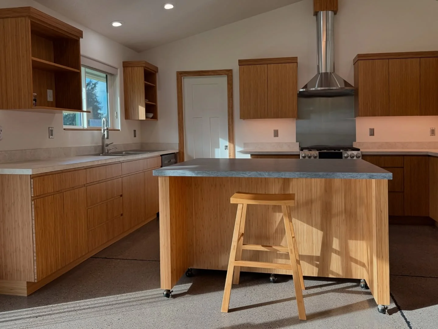 What a year! We wrapped up this project just before the year ended for a local contractor&rsquo;s own house. The bamboo immediately warmed up the space. We enjoyed figuring out how to accomplish this style of cabinetry without hardware handles&mdash;