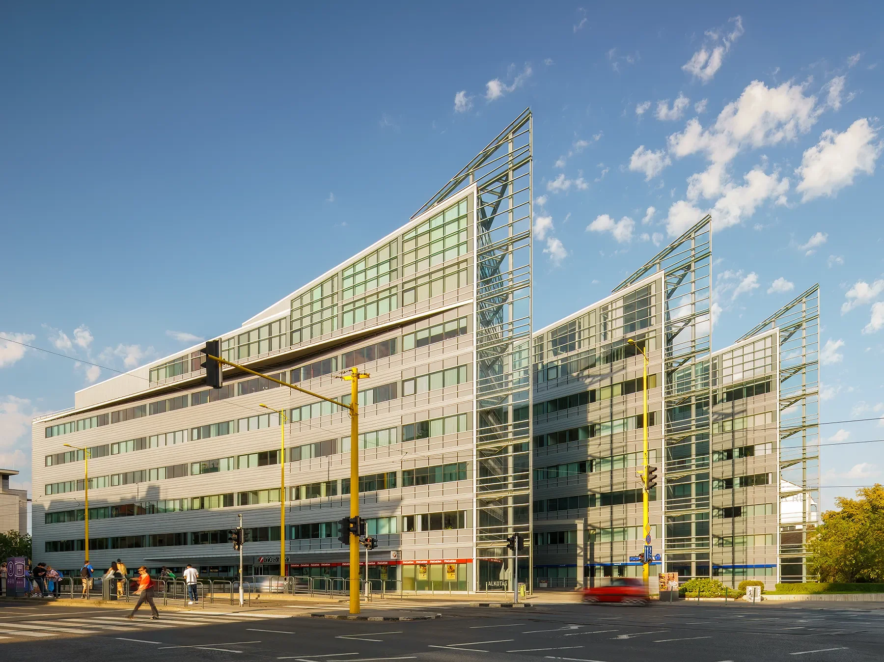Front-side view of Alkotás Point Office Budapest with three connected blocks and city traffic