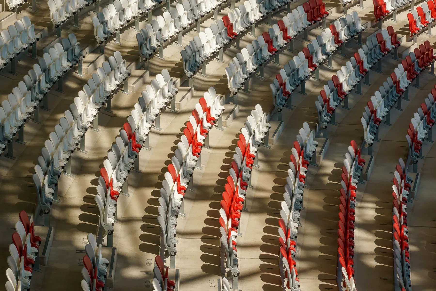 Side and top view of Budapest Athletics Stadium arena seating with white, gray, and red seats