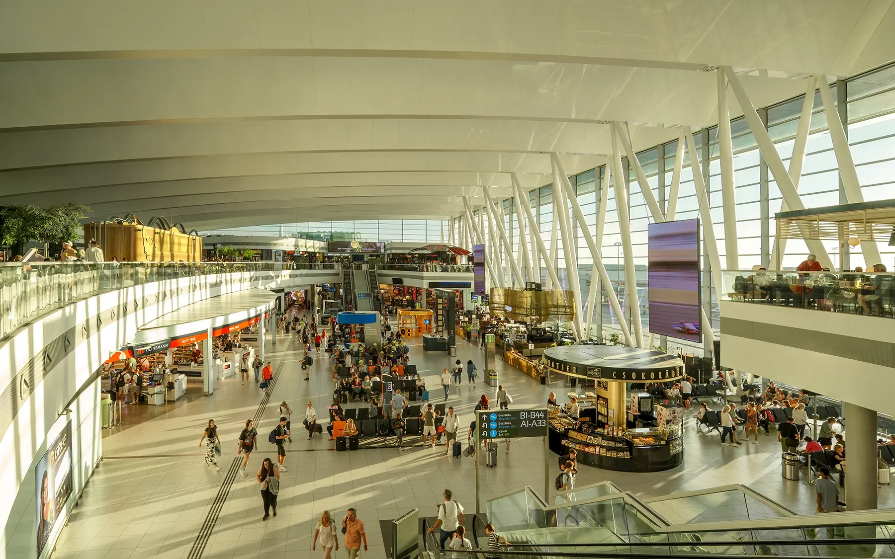Wide interior view of Budapest Liszt Ferenc Airport main hall from upper level