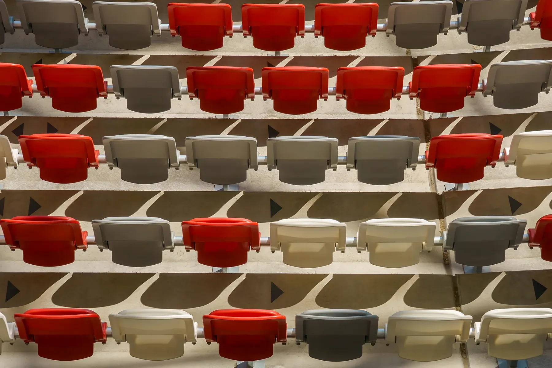 Bird’s-eye view of Budapest Athletics Stadium arena seating showing shadows and seat colors