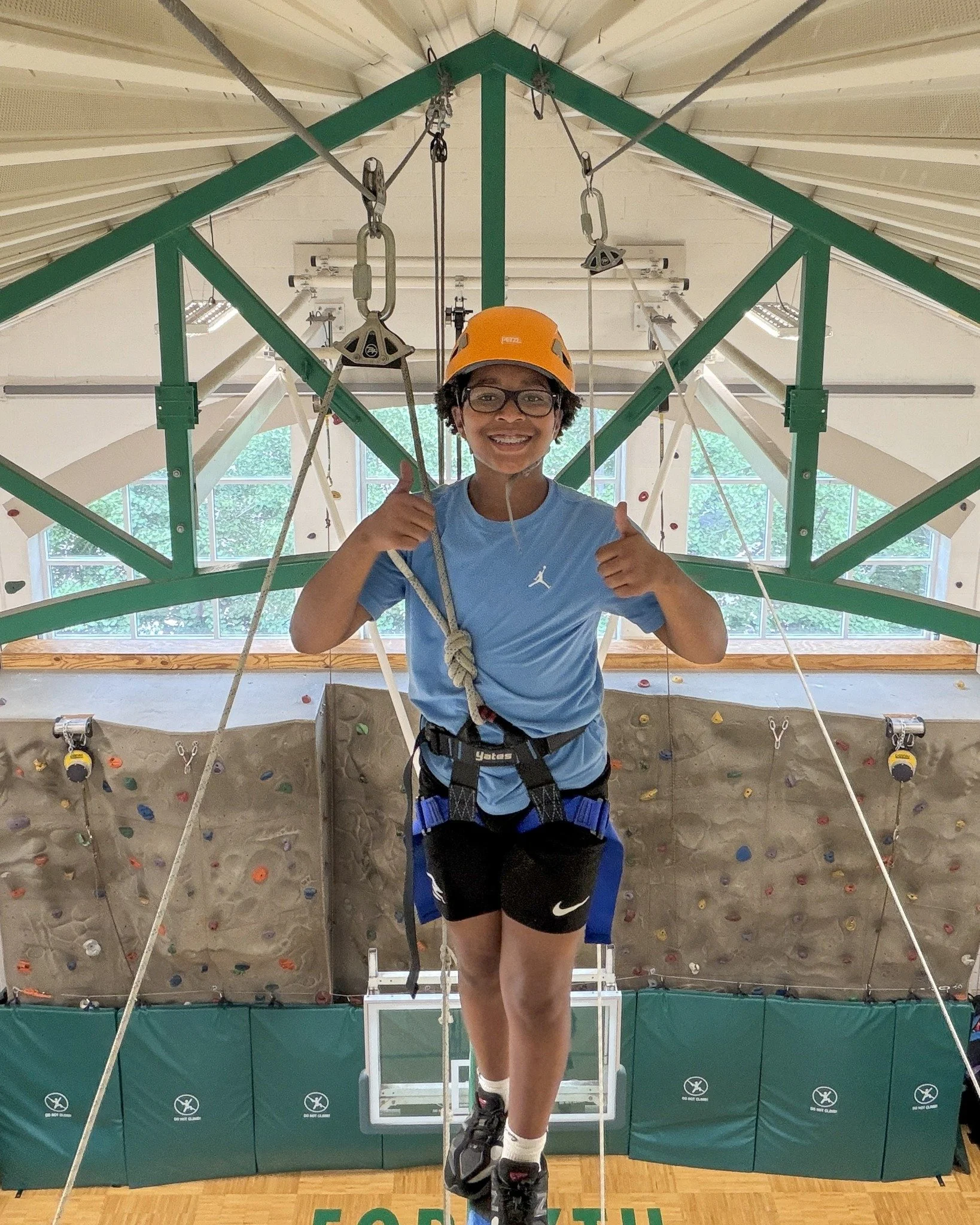 #ForsythSchool's Adventure Center progression begins with observation of the climbing wall in Eyas and Pre-K, followed by a more formal introduction to the climbing wall in Jr-K and the flying squirrel in Sr-K. By Grade 1, students are introduced to 