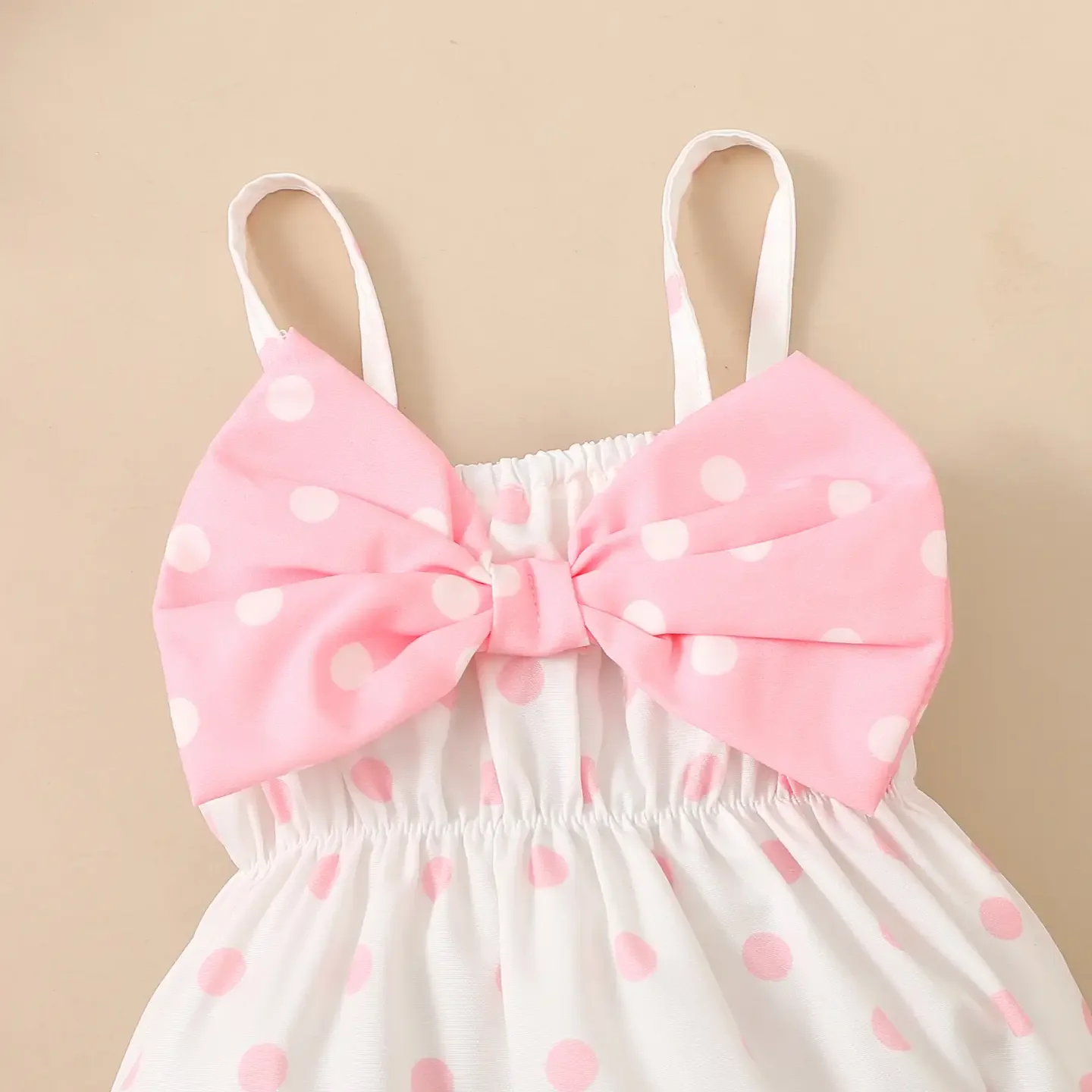 pink romper with oversized bow 2.webp