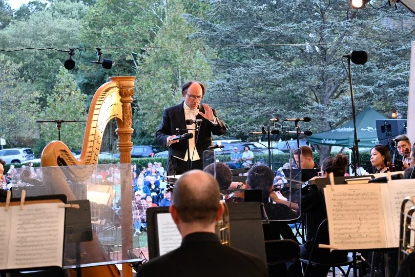 The maestro conducting the orchestra at the Musica Viva Kentlands outdoor concert.