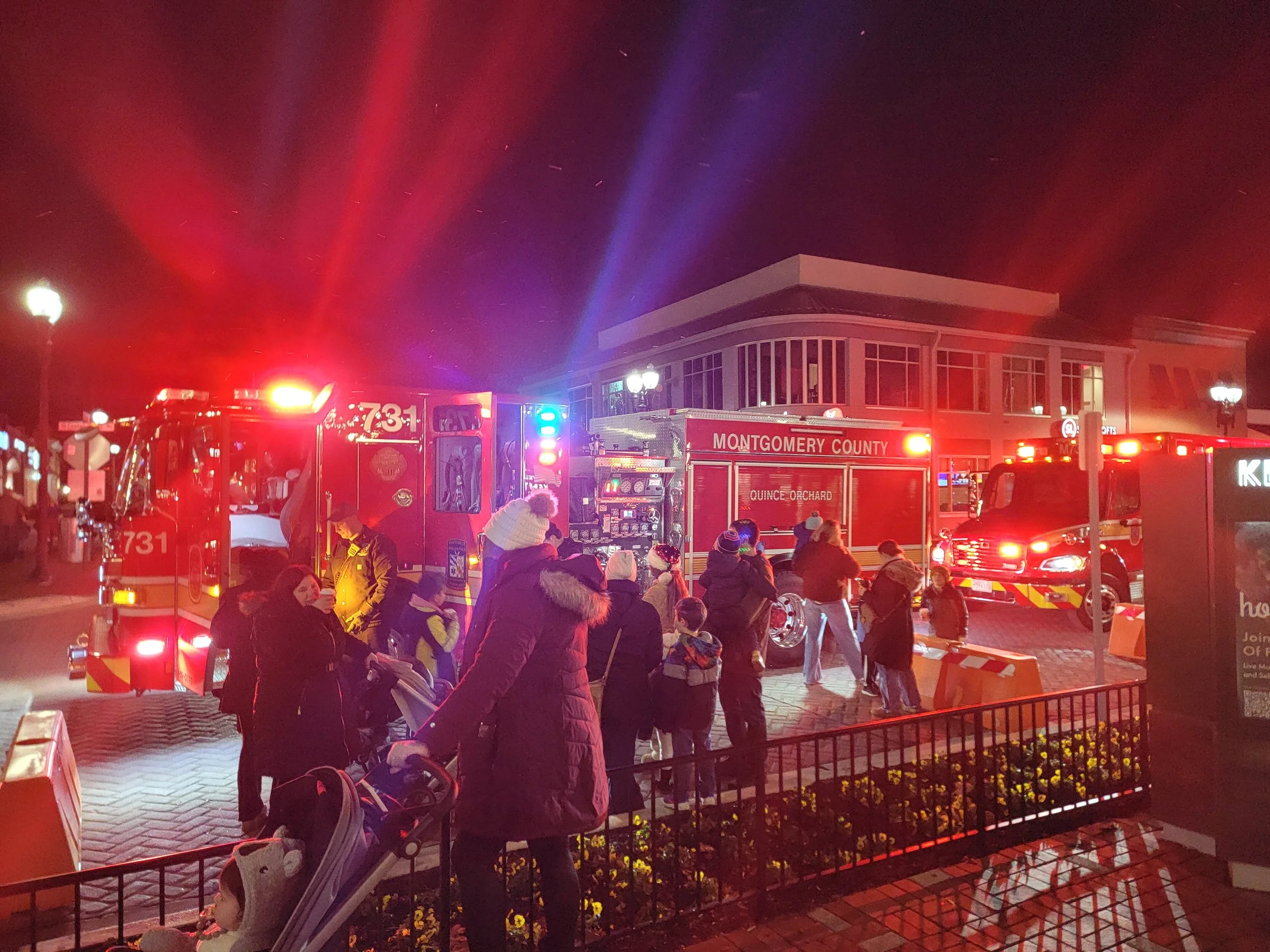 Visitors waiting to climb into a fire truck at the Tree and Menorah Lighting event