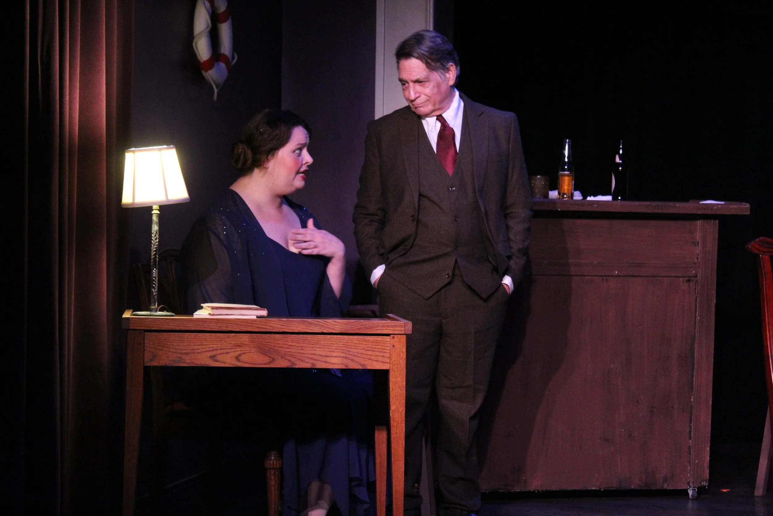 A woman and man having a conversation in the Kentlands Community Players' production of 'Outward Bound'