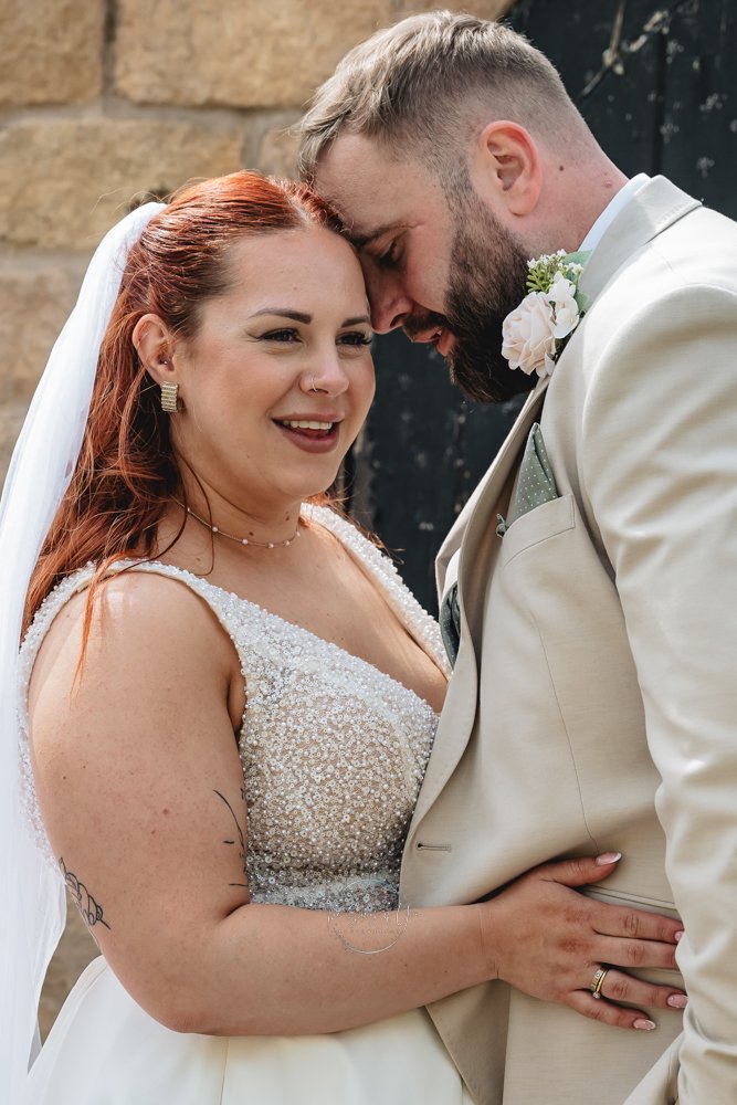 Wedding couple sharing a close moment