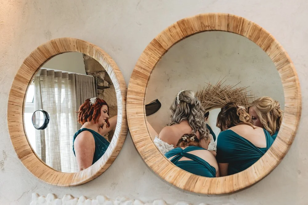 Bride getting ready and reflected in mirror