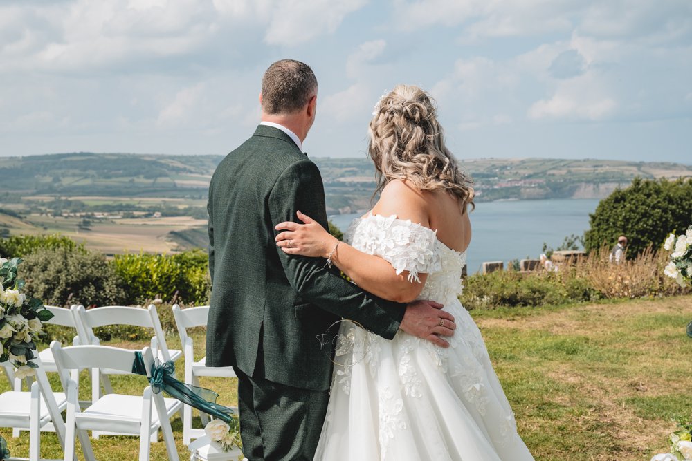 Couple at Grand Villa Heights overlooking the bay