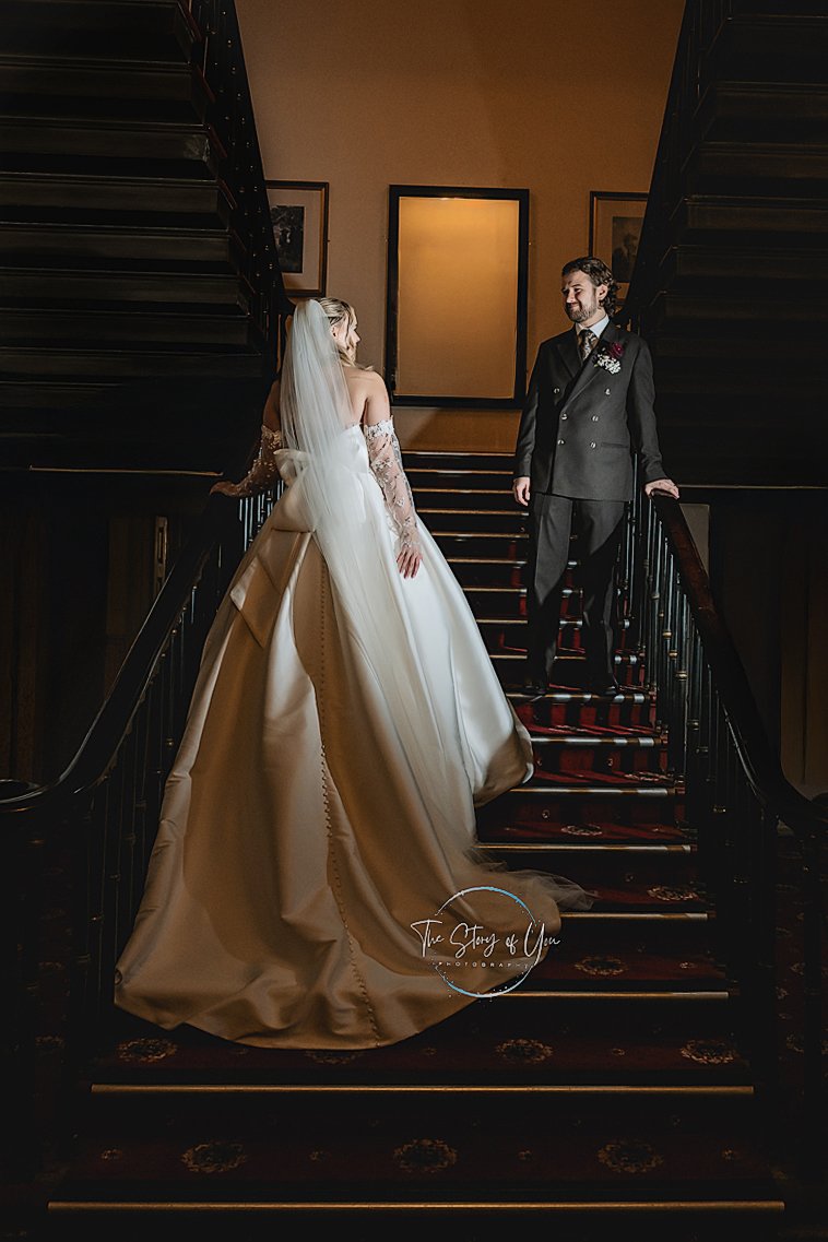 Bride and Groom standing on the staircase at Wortley Hall at a Yorkshire Wedding