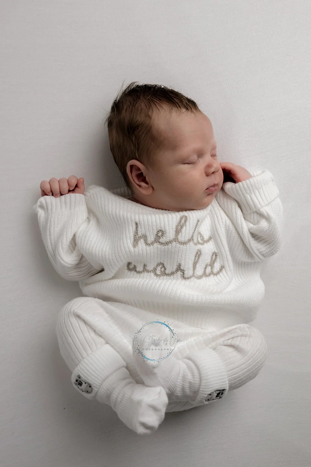 Relaxed and sleeping newborn on white background