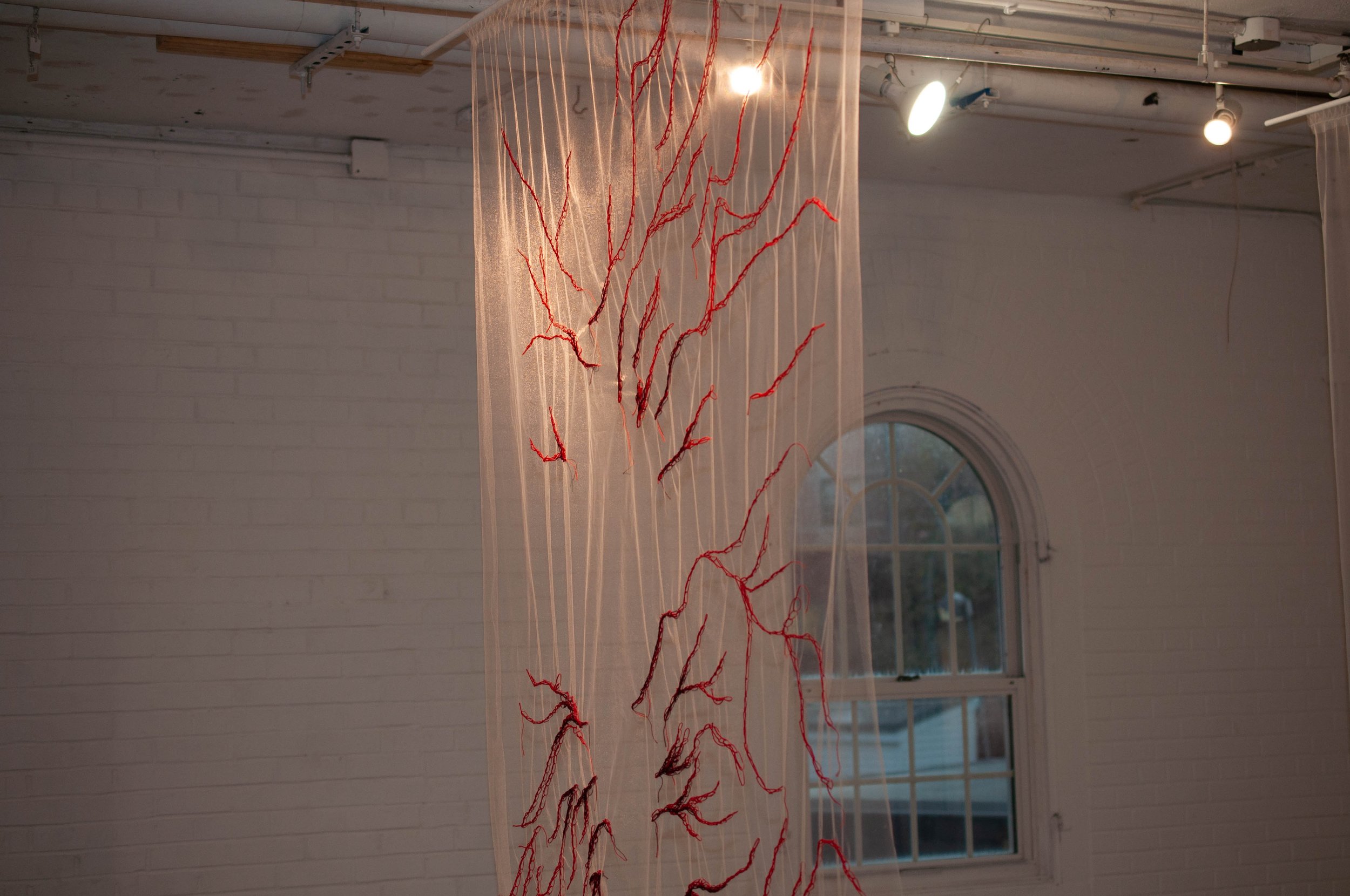 Schism | WIP | Embroidery Thread, Tulle, Wooden Dowel | 7' x 5'