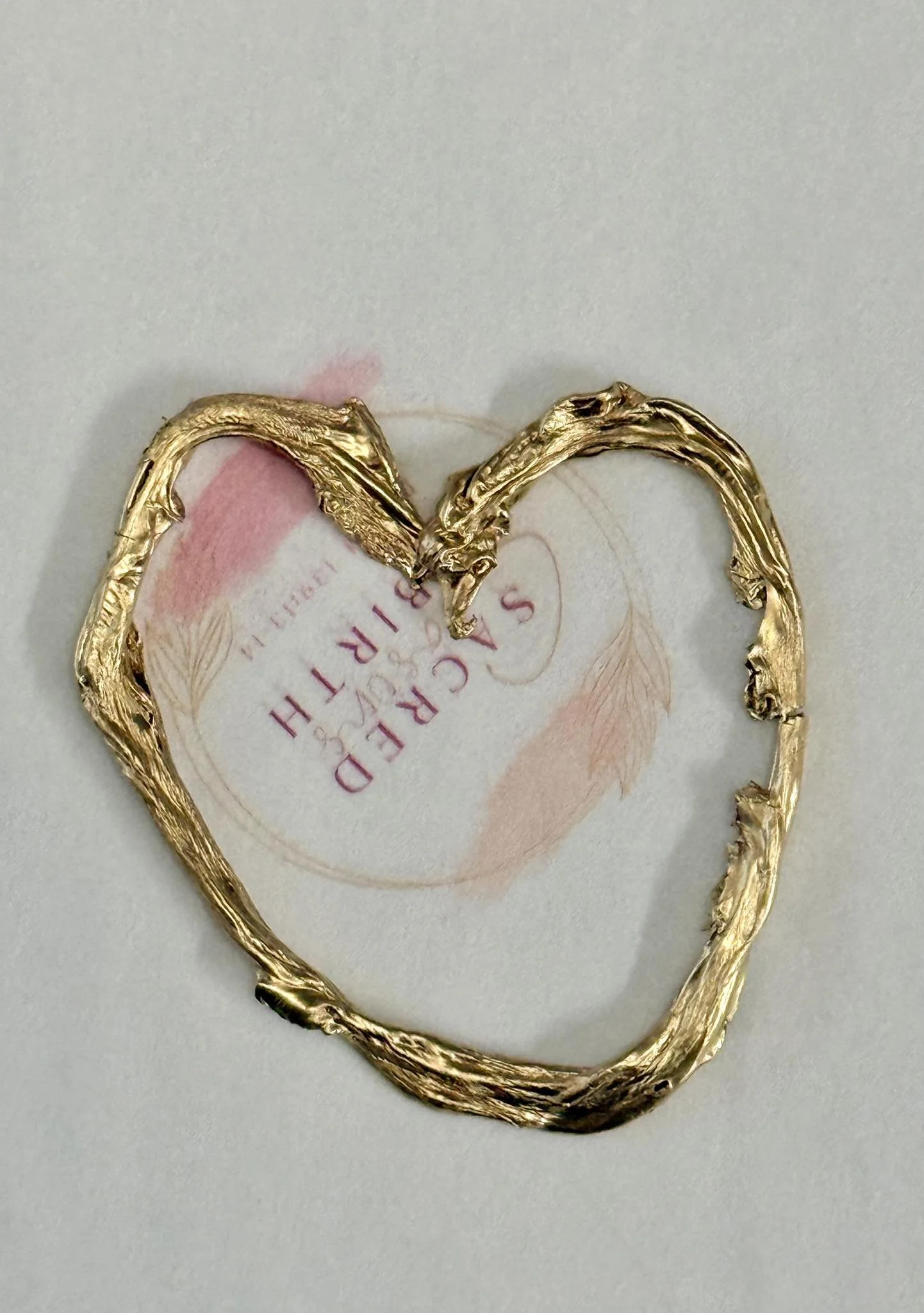 an example of a gold painted cord keepsake posted by Dana in the reviews