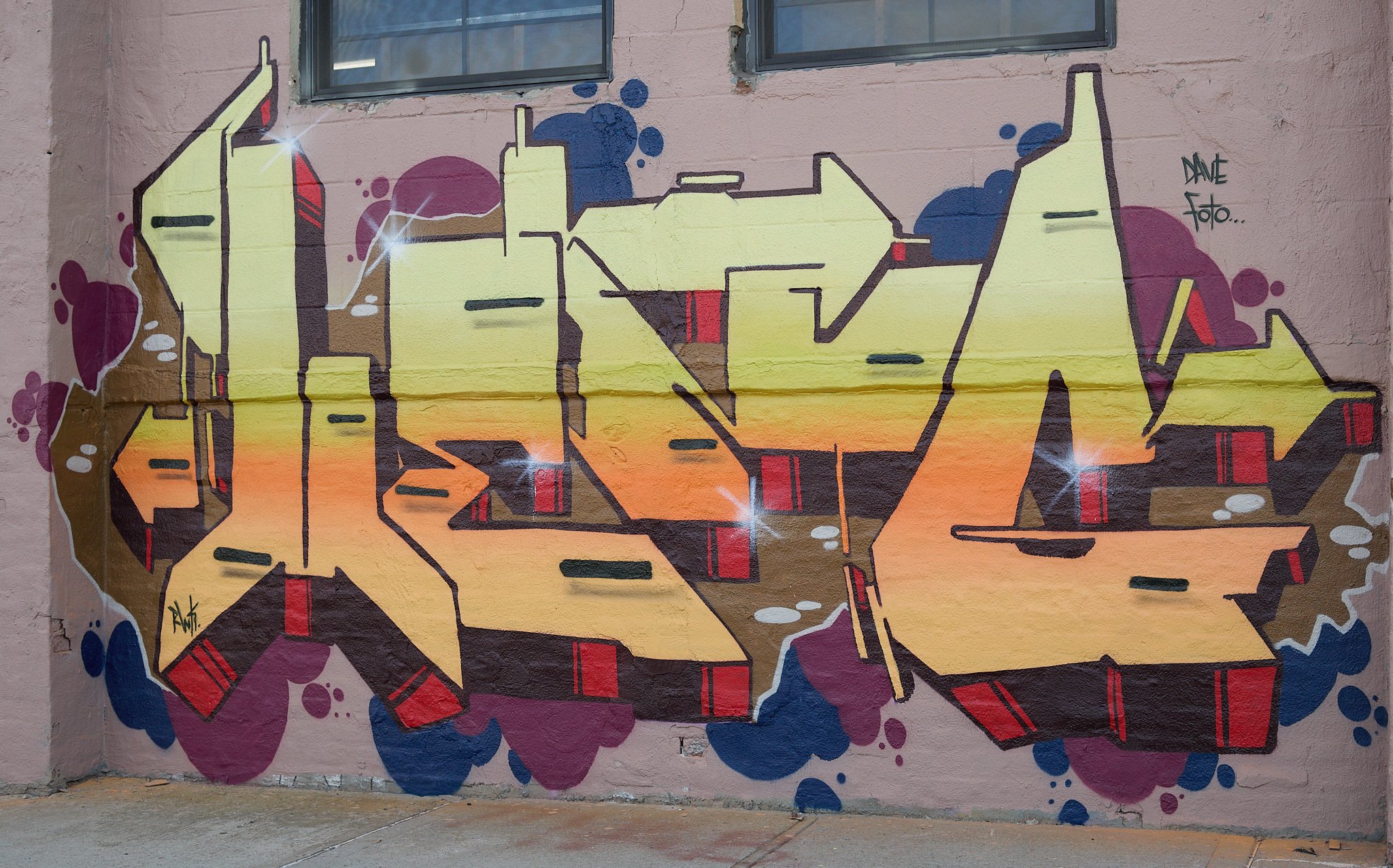 colorful graffiti lettering on smooth wall