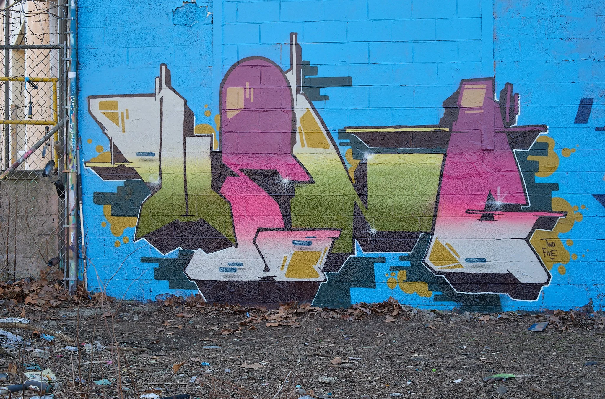 Colorful graffiti art lettering on brick wall