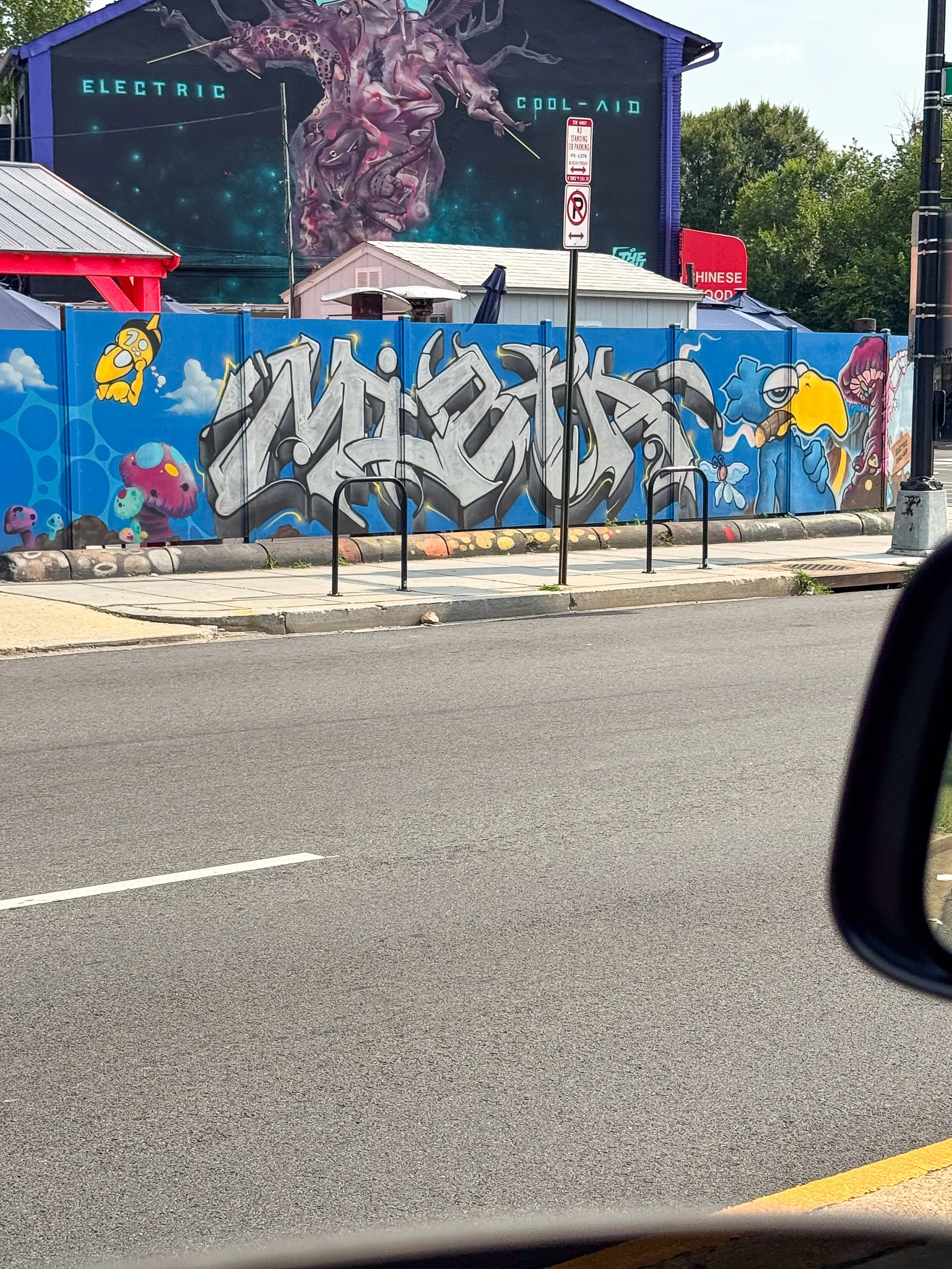 creative city district large murals graffiti lettering art busy urban cityscape