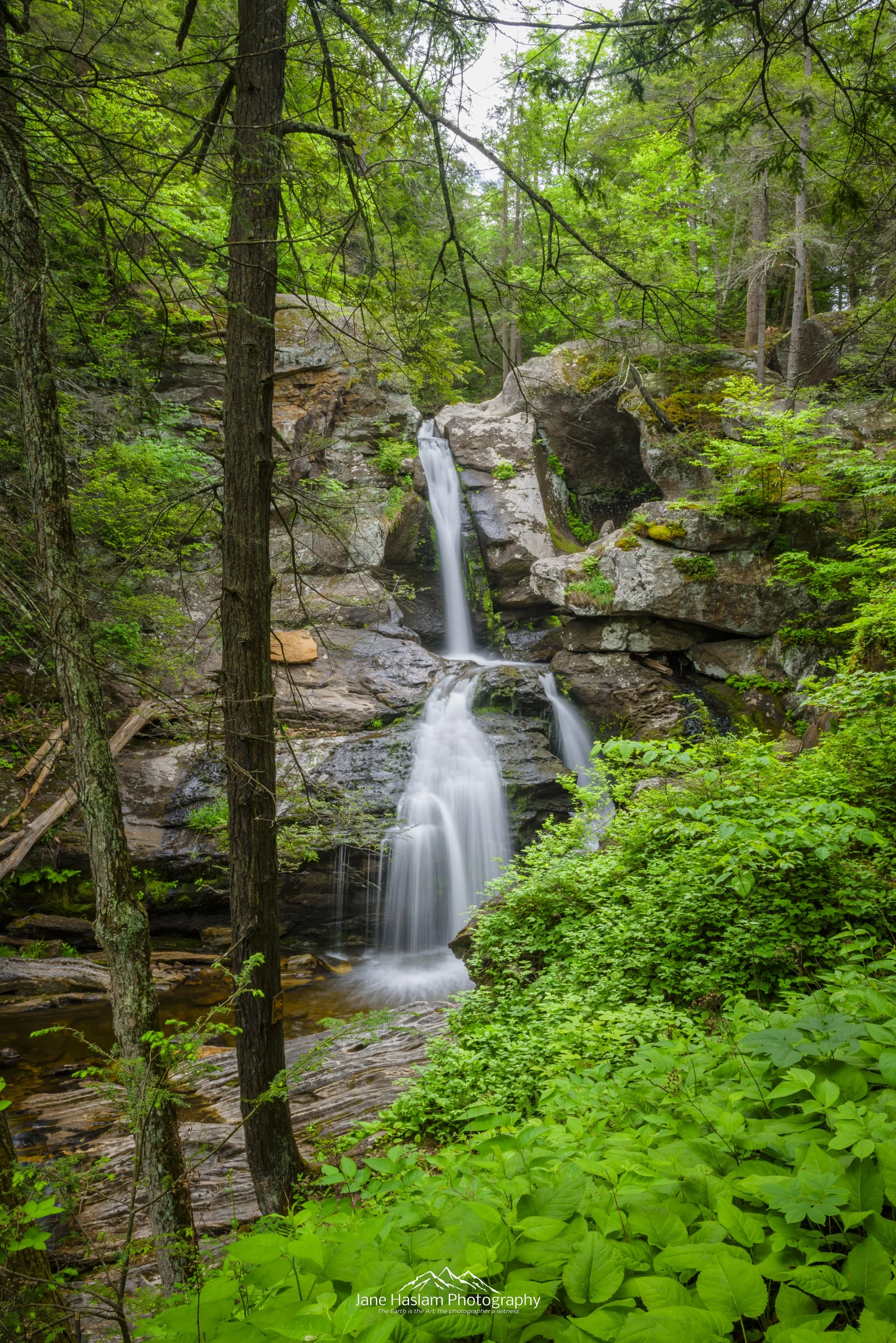 Emerald Greens: A Long exposure at Kent Falls. Lush green foliage frames the the beautiful cascade of the upper falls at Kent, Connecticut