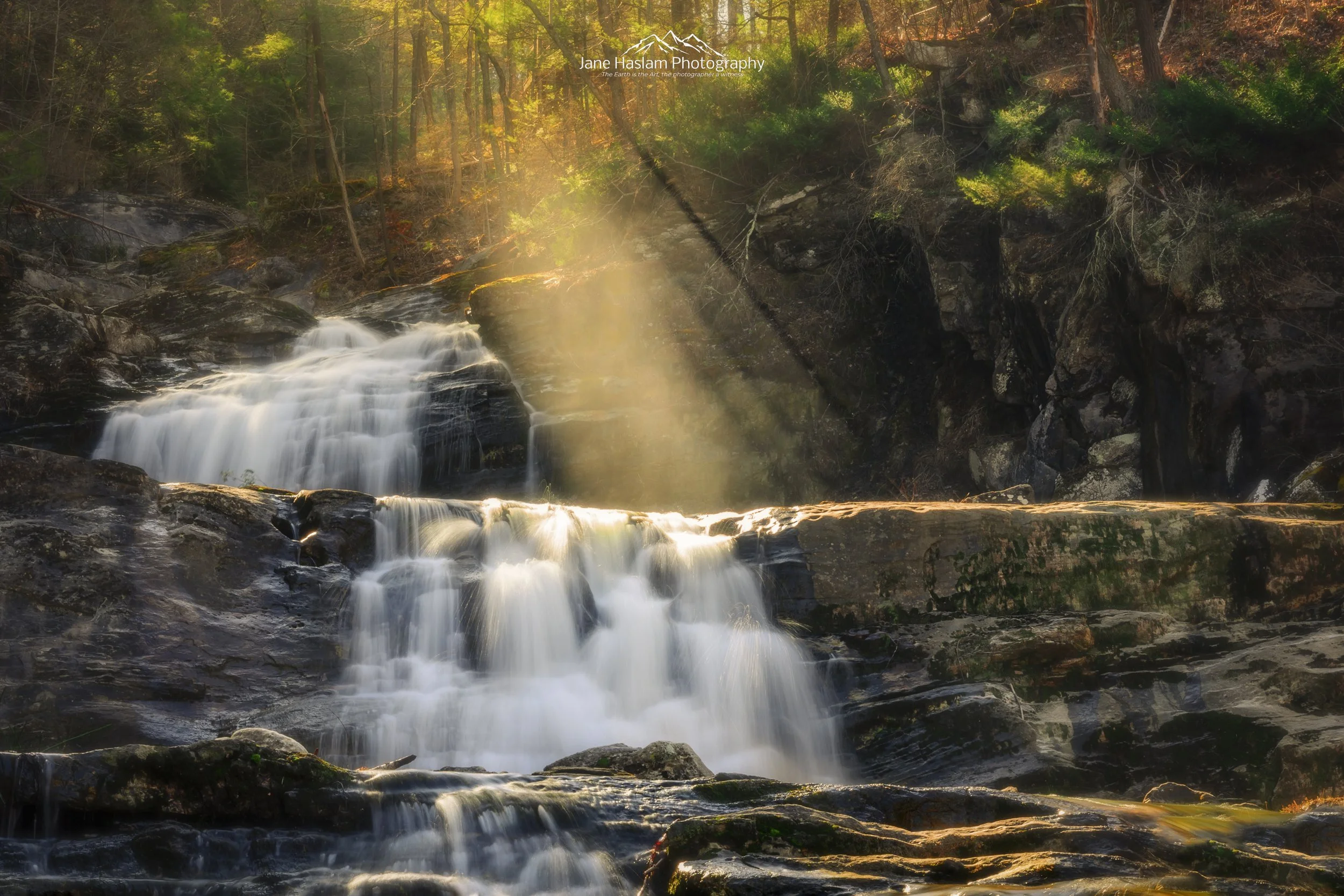 A Beautiful Gift: Spring sunbeams illuminated in the early morning spray at the lower portion of Kent Falls in western Connecticut.