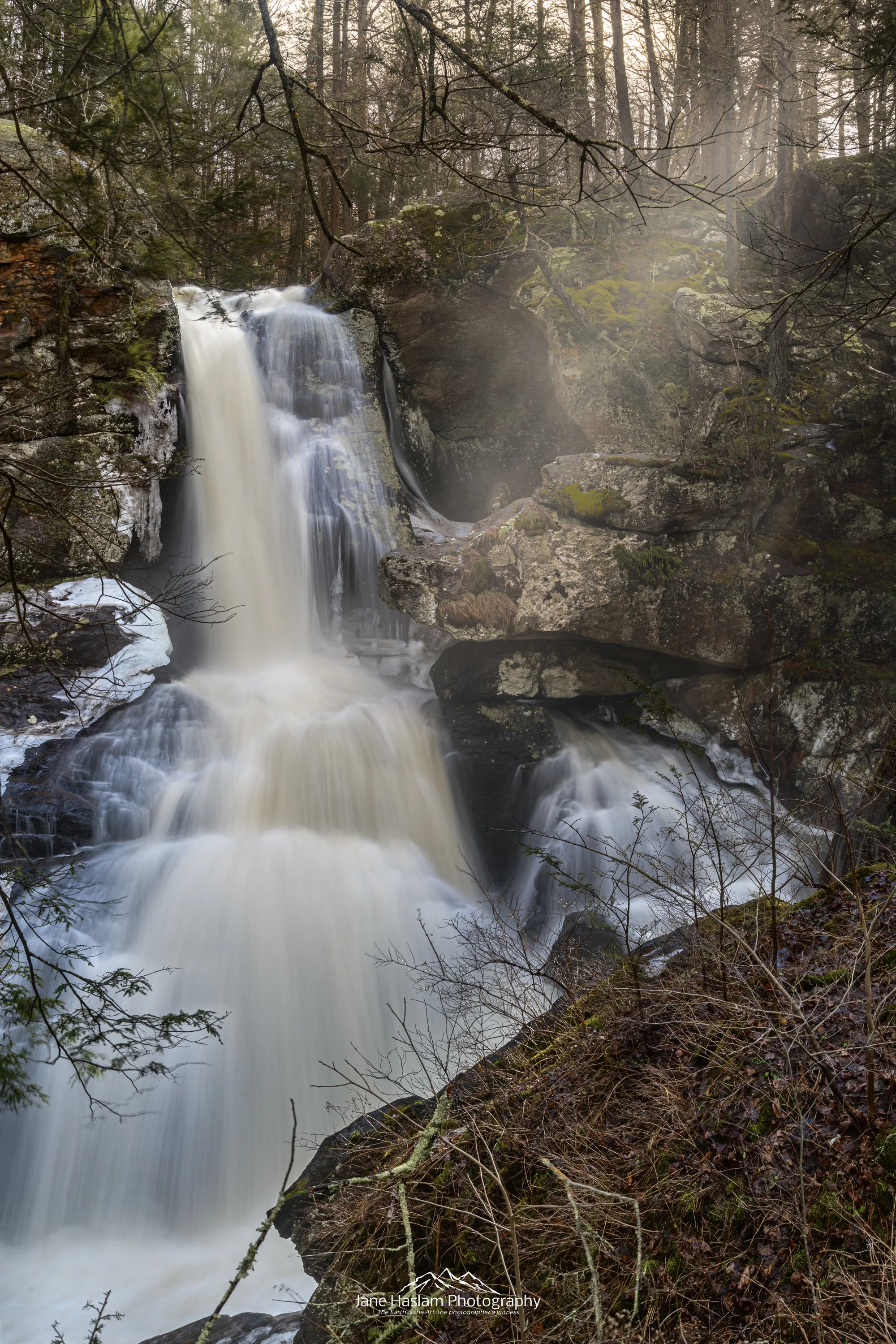 Thaw: A Long exposure at Kent's upper falls. taken early on a winter morning. Unseasonally warm temperatures in late February begin the transition to Spring. Kent Falls in Western Connecticut