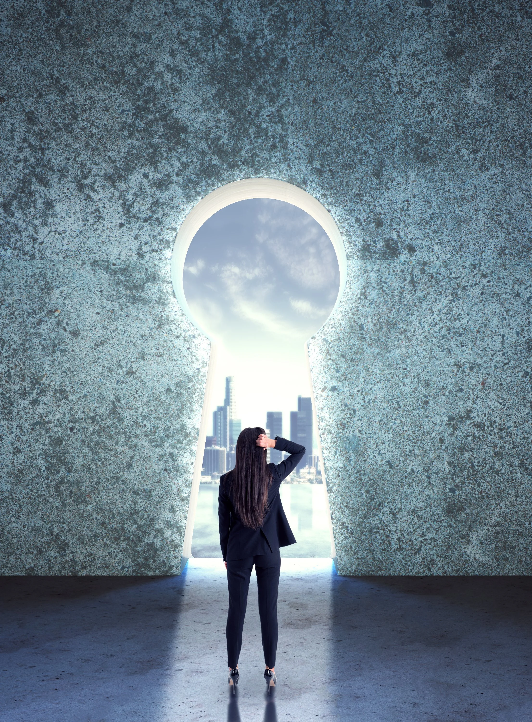 Woman in business attire standing in front of a large keyhole-shaped opening in a textured wall, visualizing future opportunities.