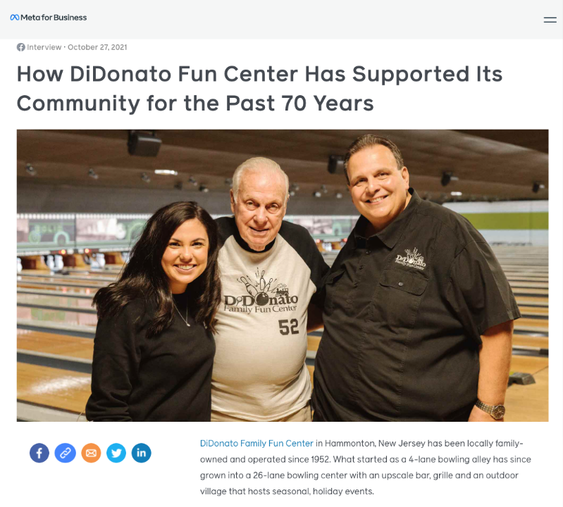 Photo of three people standing inside a bowling alley, smiling at the camera. The woman on the left has long dark hair and is wearing a black top. The man in the middle is older with white hair, wearing a light-colored shirt with the DiDonato logo. The man on the right has short hair, wearing a black polo shirt with the DiDonato logo. The background shows bowling lanes and scoring monitors.