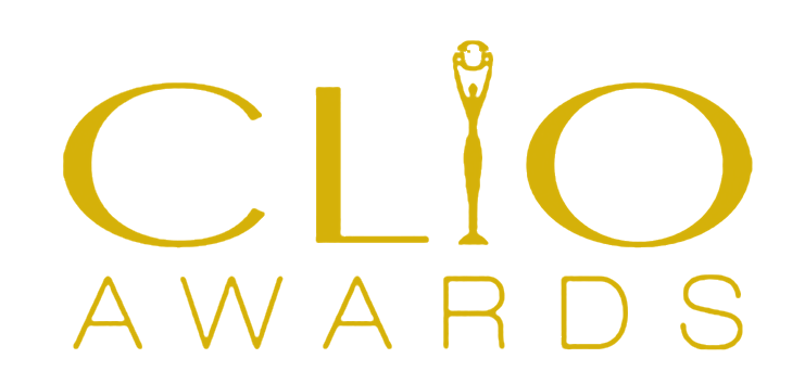 Logo for CLIO Awards with the word 'CLIO' in large gold letters and 'Awards' underneath in smaller gold letters, with a trophy icon integrated into the letter 'I' in 'CLIO'.