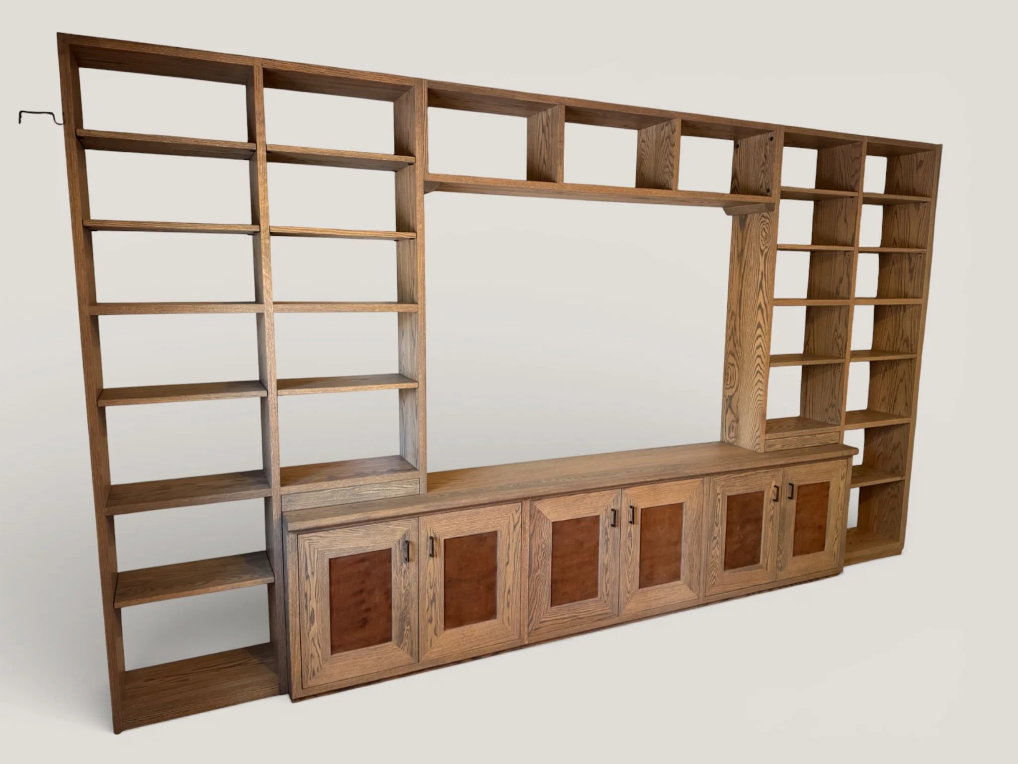 RED OAK CABINET AND SHELVING UNIT WITH RUSTED METAL DOORS. 10' X 8' X 18"