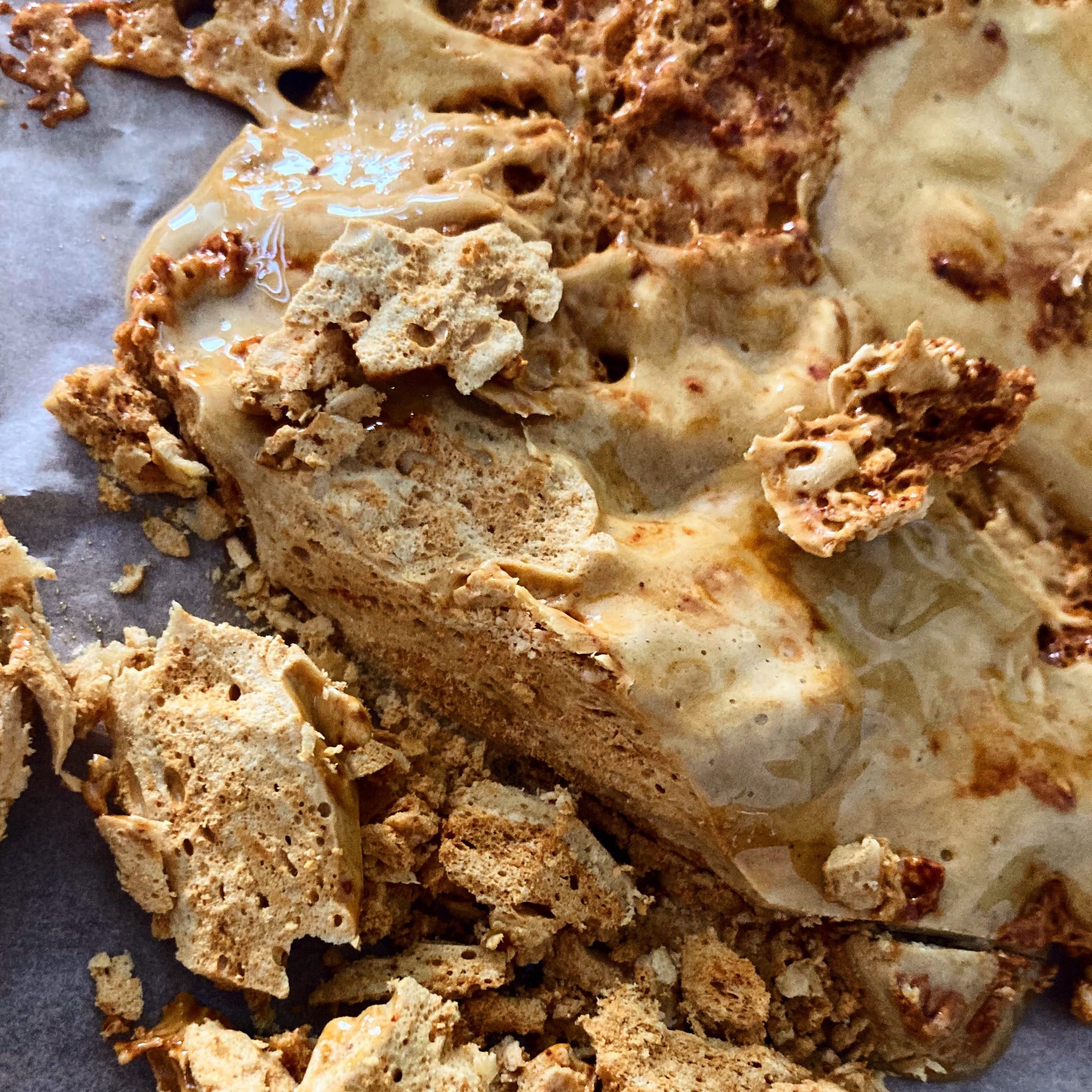 Close-up of homemade organic honeycomb, partially artfully broken.