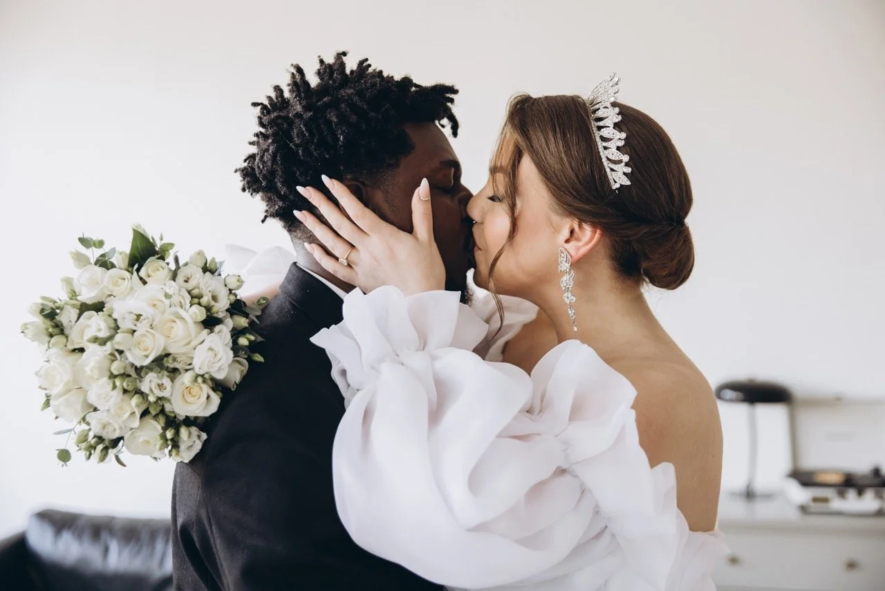 Interracial Couple Kissing during Wedding Ceremony Large.jpeg