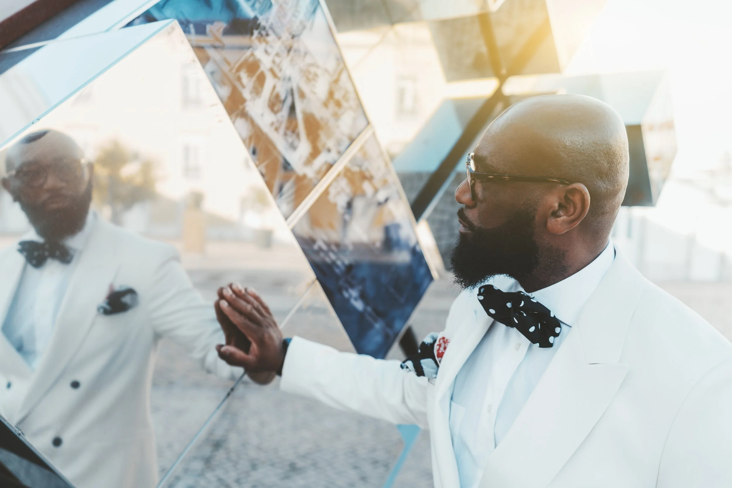 Black Guy Touching Outdoors Mirror.jpg