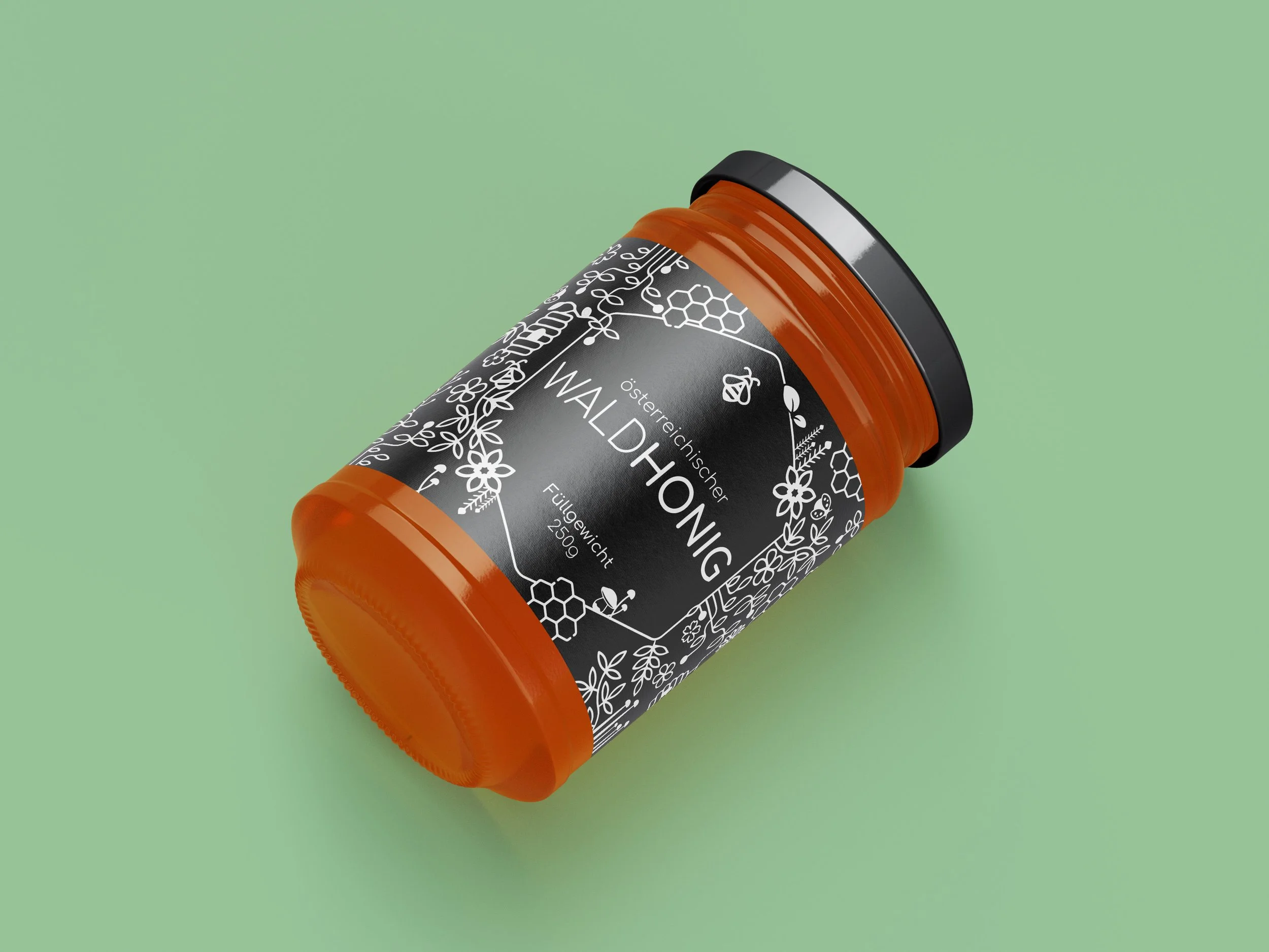 An honey jar with a black and white label featuring botanical illustrations, lying on a light green background.