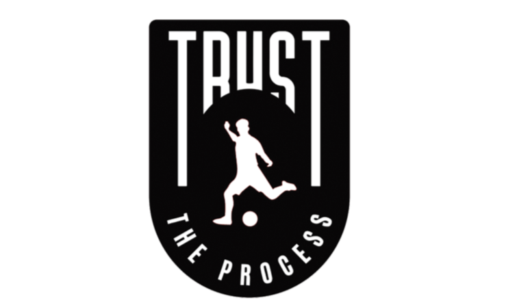 Logo with the word 'TRUST' at the top, a silhouette of a child kicking a soccer ball in the center, and 'THE PROCESS' curved at the bottom, all in black and white.