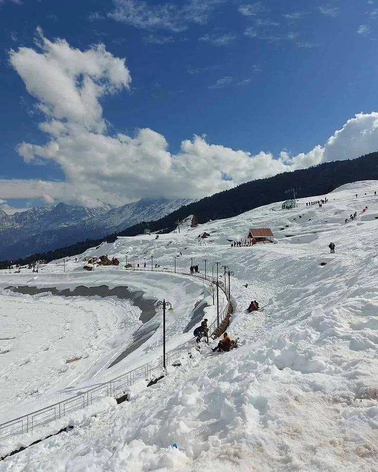 Image of Devotees at Temple – Devotees offering prayers at Kedarnath Temple in summer