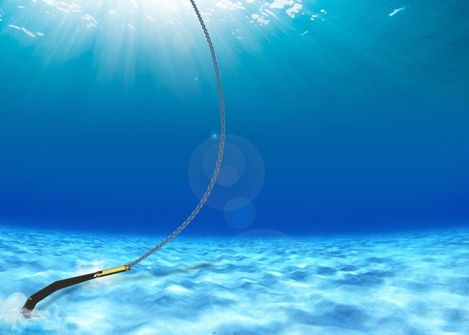 Underwater view of ocean floor with an anchor and chain. Sunlight beams down from the surface above.