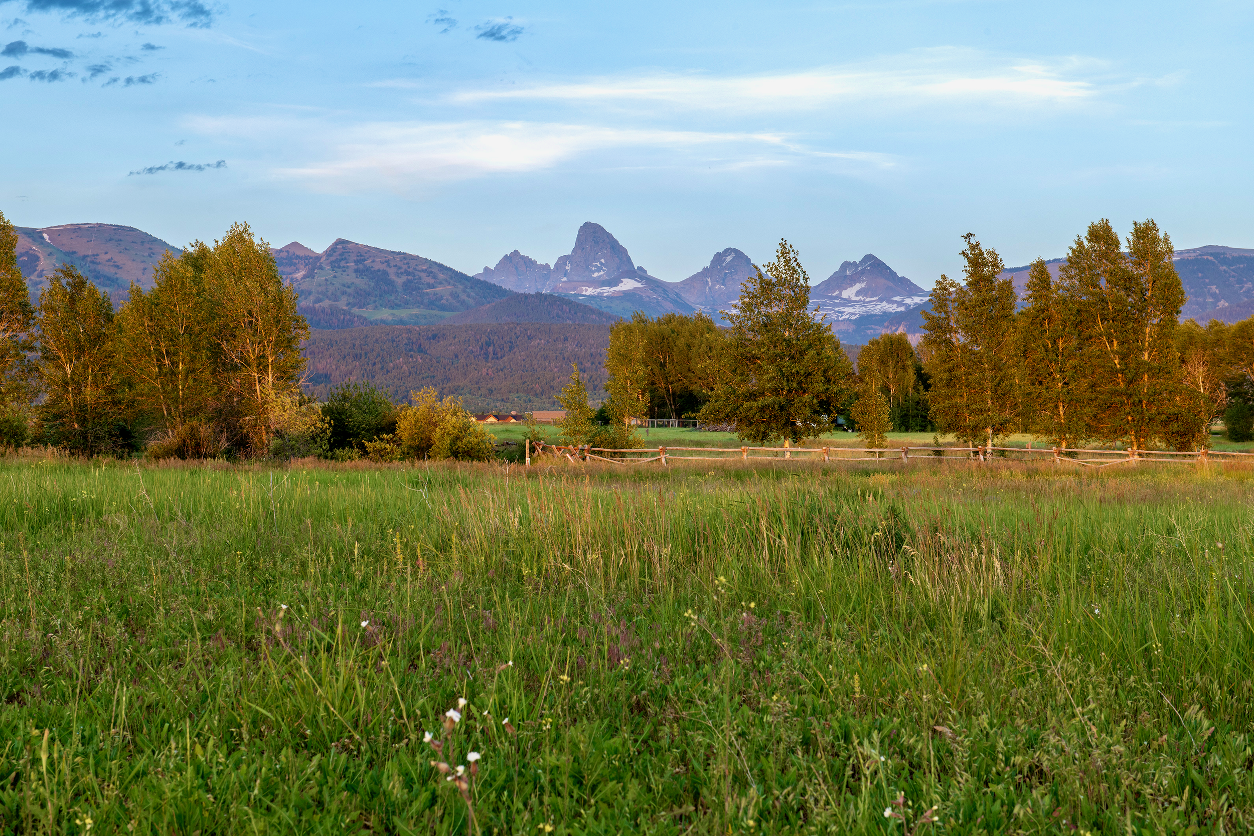 Stunning mountain vistas showcasing the three iconic Teton peaks, seen from private outdoor space at 5-bedroom vacation rental near Jackson Hole