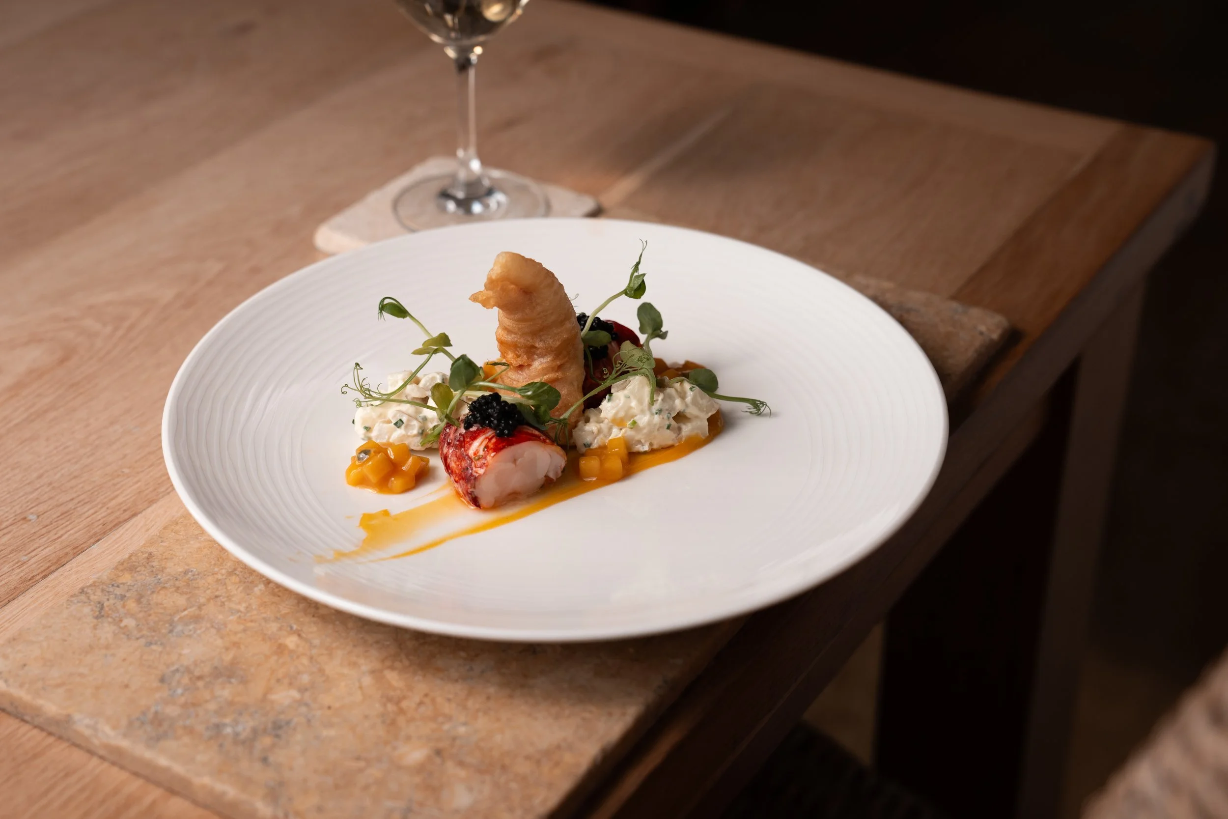 Jersey royal and poached lobster salad with mango and passion fruit dressing and tempura of the claw by Mark Jordan