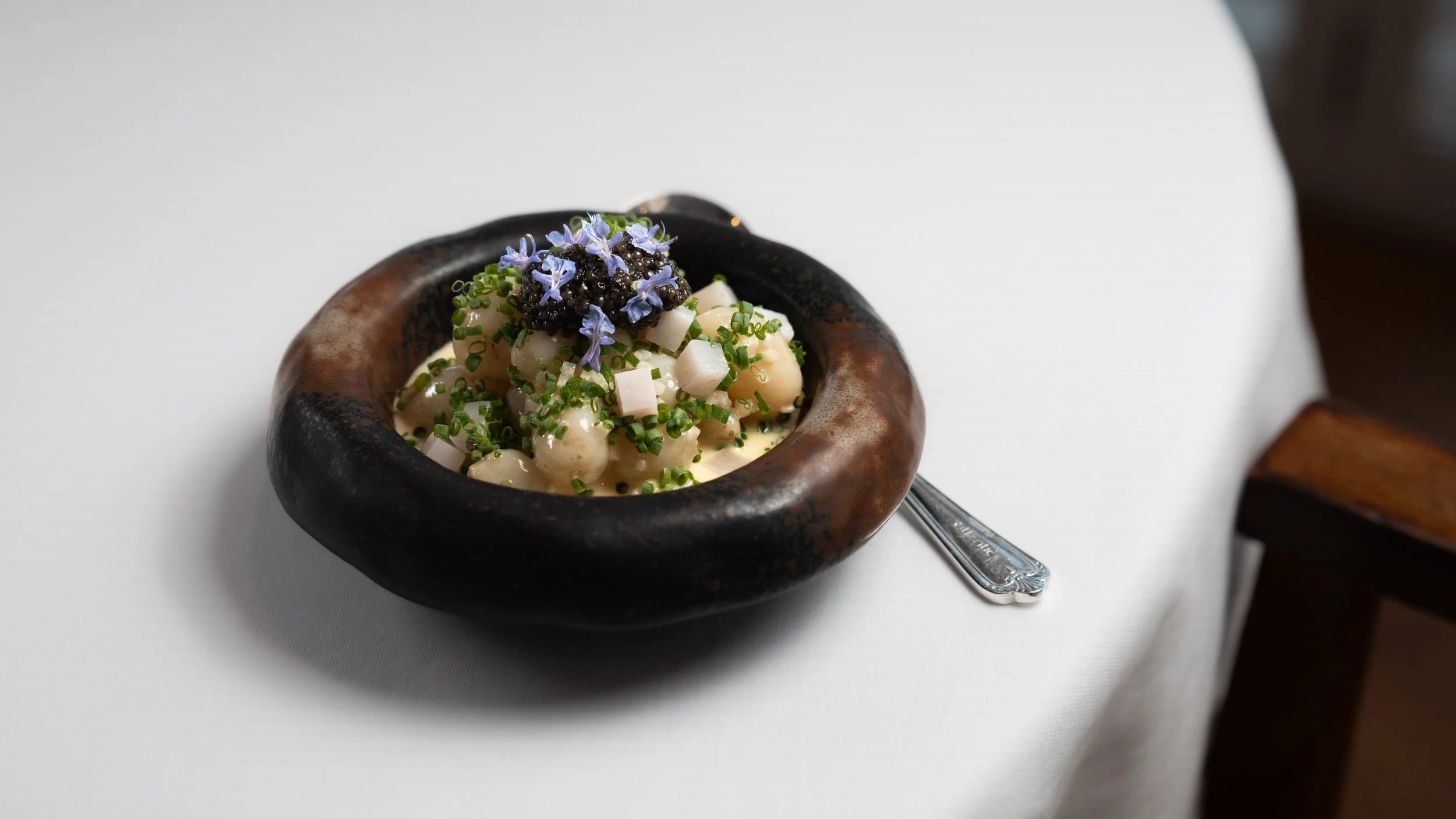 Jersey Royal Pearls with Chive Beurre Blanc, Lardo, and Caviar by Will Holland