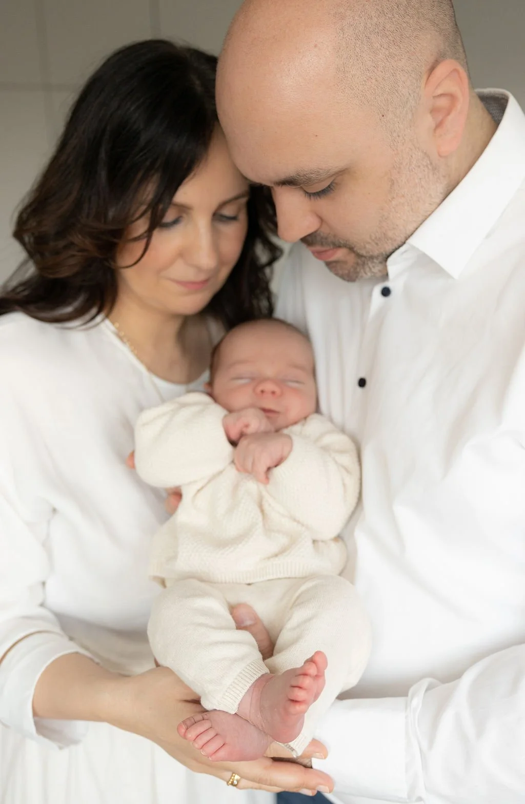 Fotoshooting der Eltern mit dem Neugeborenen.jpg