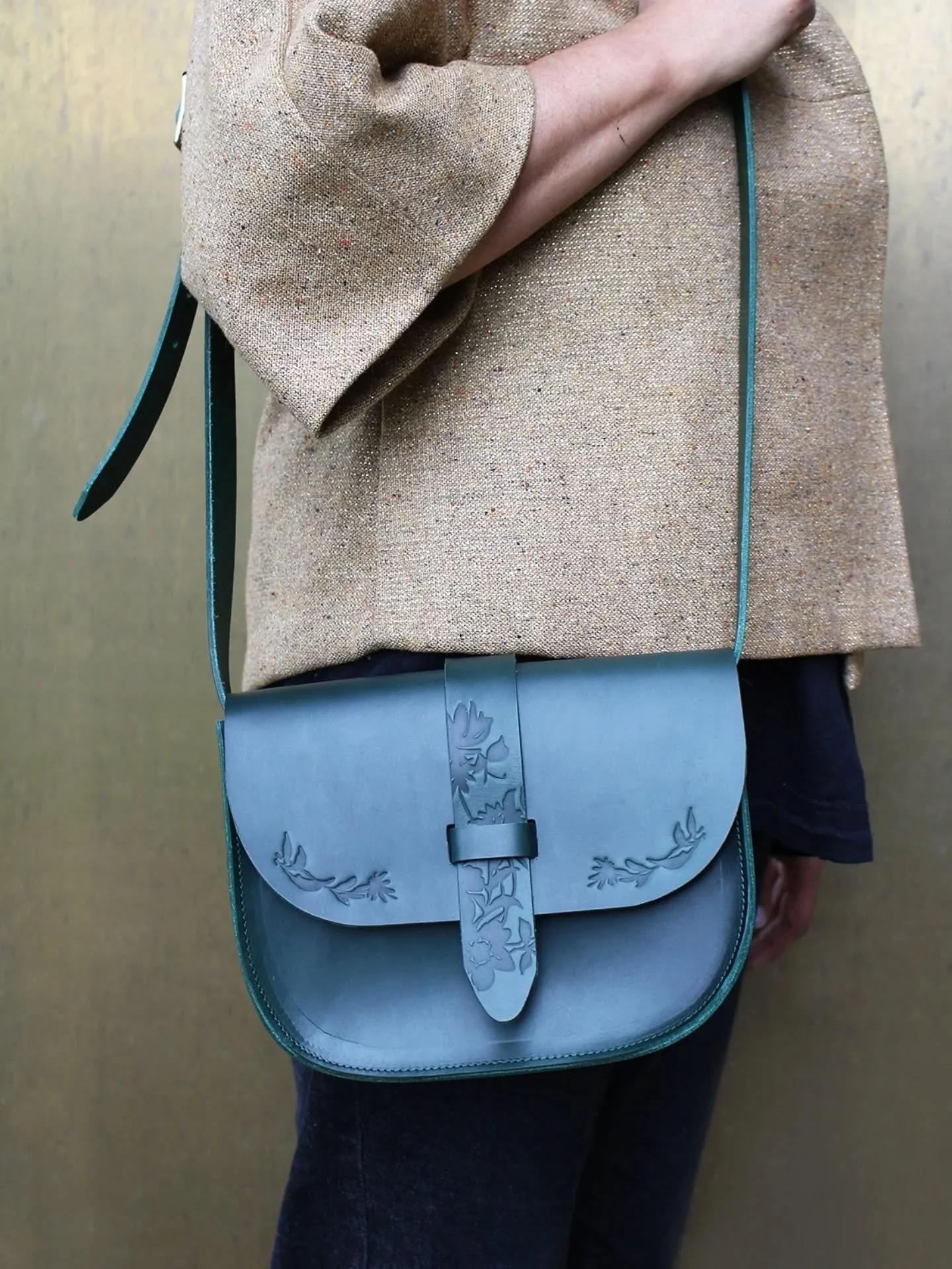 A new saddle bag I've created and available to buy. I was inspired by that kind of traditional American style hand tooled leather bags. The flowers embossed on the flap and strap of the bag were drawn by me, then made into dies so that I could imprin