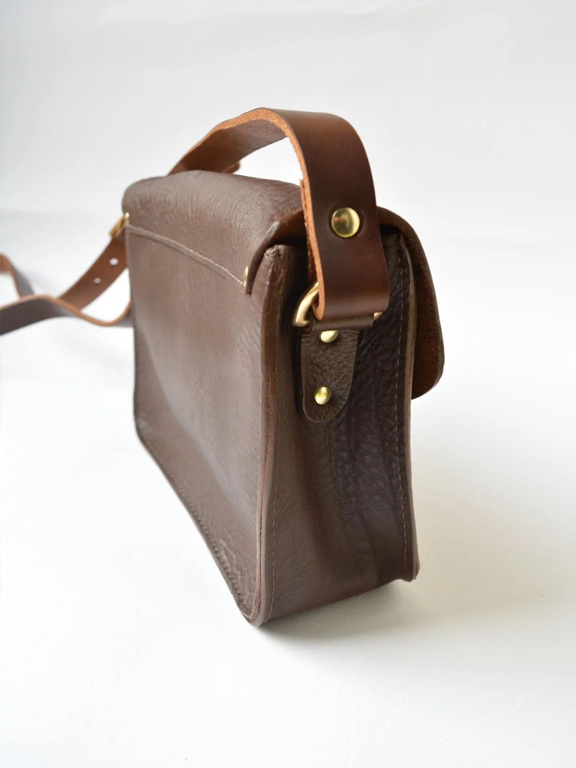 natthakur-mini-leather-map-satchel-side-view.jpg