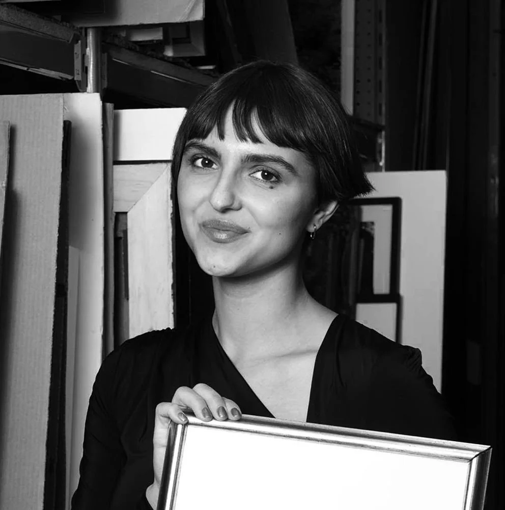 alicia bojkov holding artwork