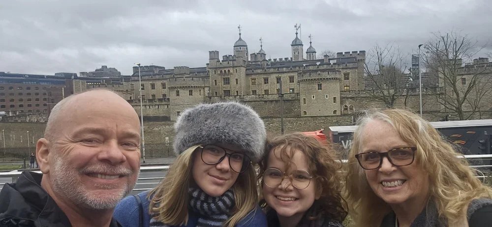 My wife, two daughters, and I in front of the Tower of London.